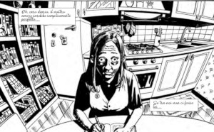Valery che scrive in cucina, con un effetto ottico da obiettivo fotografico